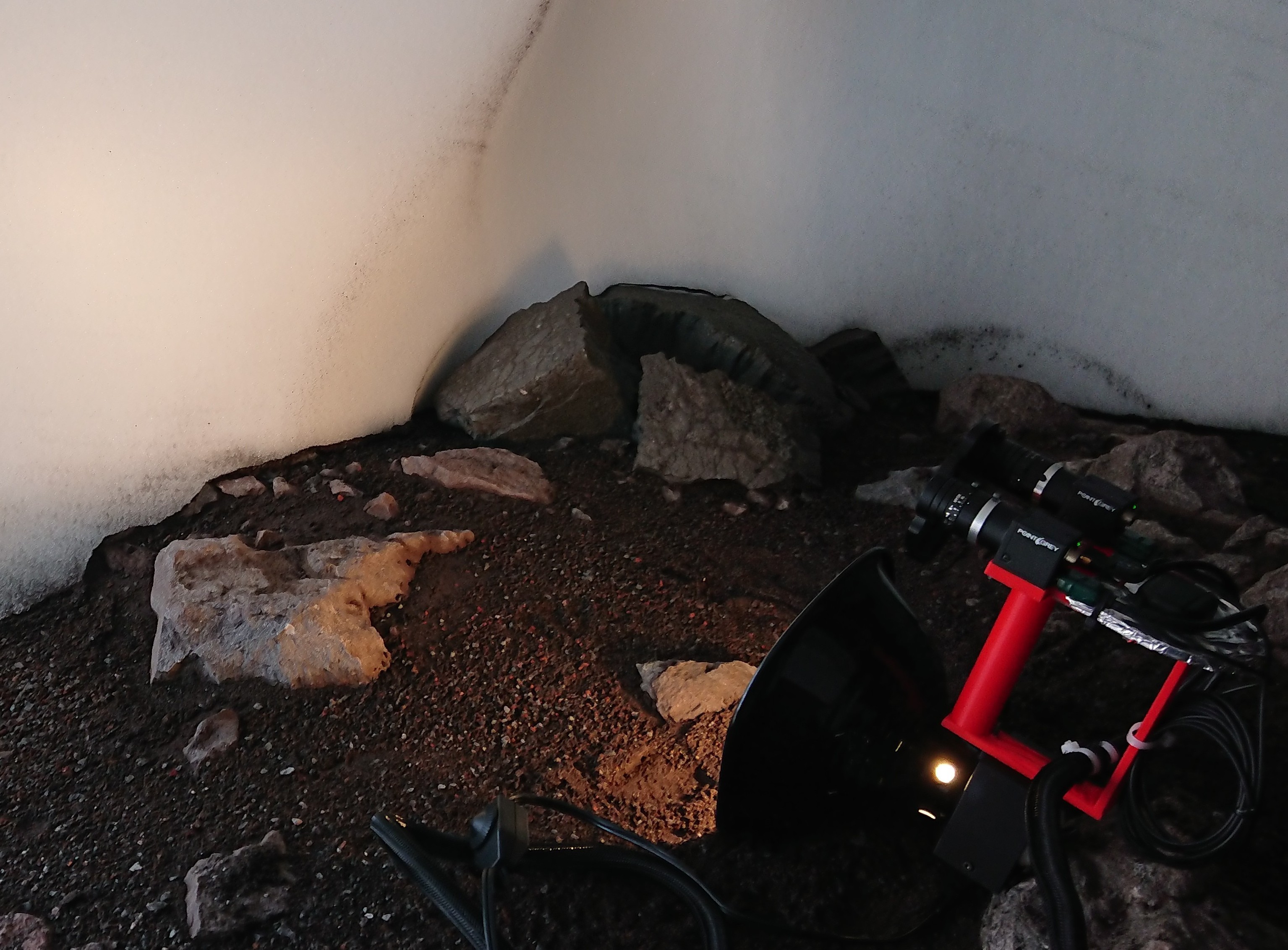 Visible-light and near-infrared camera rig beside a firn wall at Mount St. Helens.